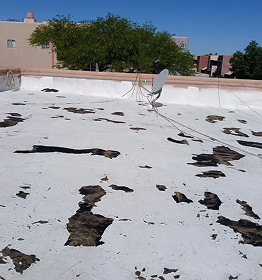 Weathered roof with chipped coating